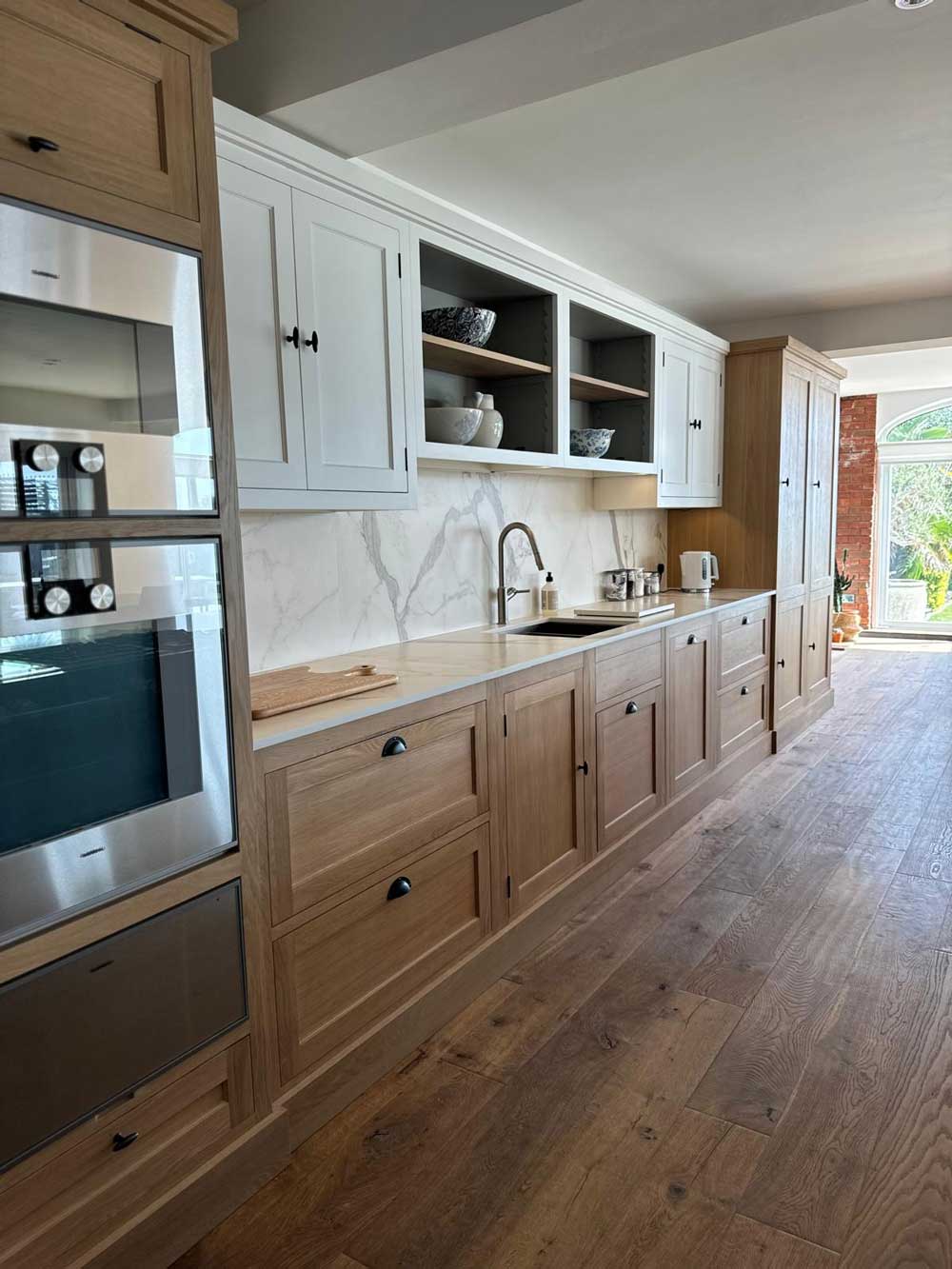 Porcelain kitchen island with full-height matching splashback